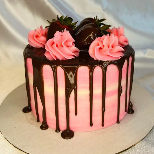 Vanilla Cake Topped with Chocolate and Strawberries